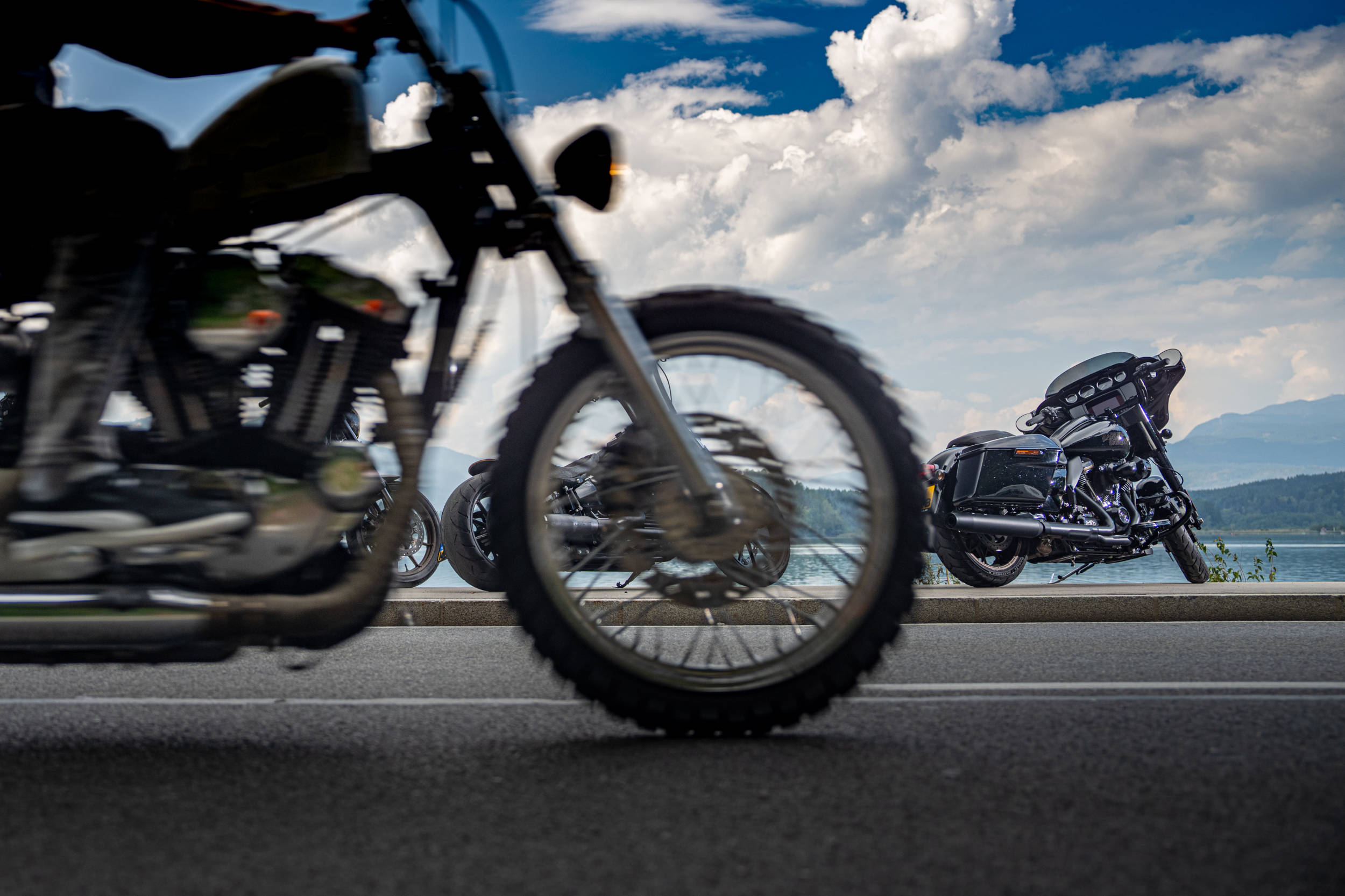Motorcycle riding past with bikes in the background