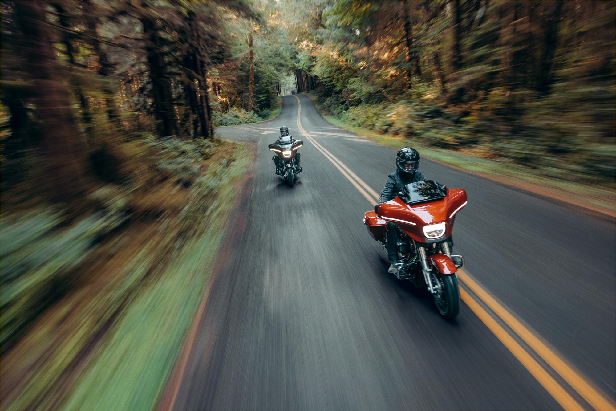 Two motorcyclists on a ride out through the countryside